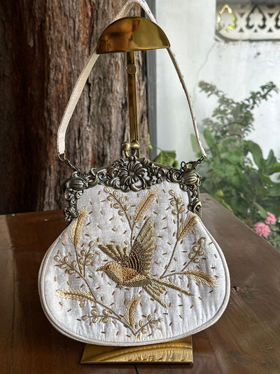 Off White Shade Vintage Bird Motif Ari Sling Bags