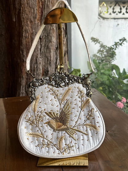 Off White Shade Vintage Bird Motif Ari Sling Bags
